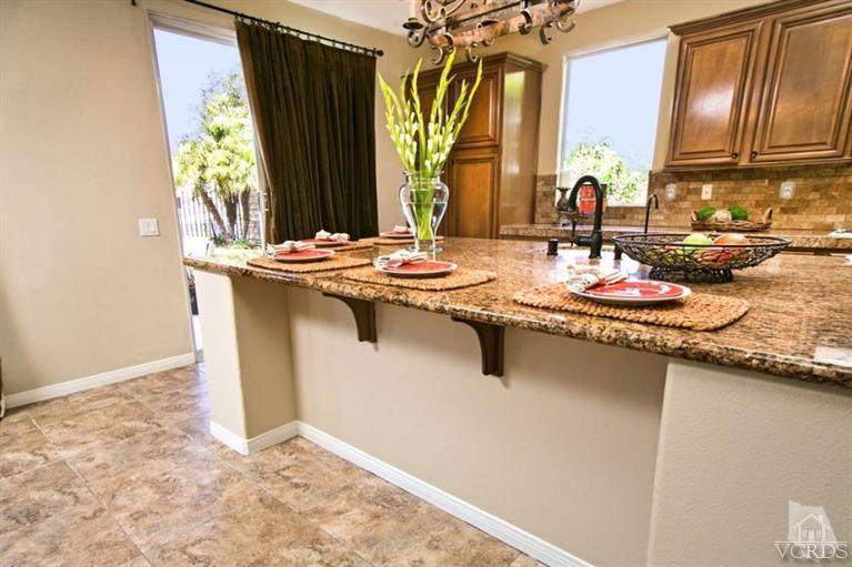 14303 Peach Hill Road Moorpark, CA 93021 - Photo 13 of 41 a bathroom with a granite countertop sink and a mirror