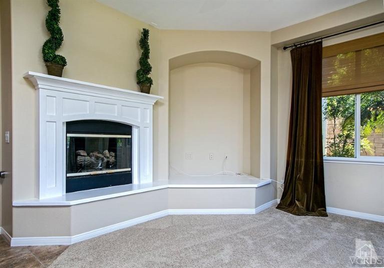 14303 Peach Hill Road Moorpark, CA 93021 - Photo 18 of 41 a view of livingroom with furniture and a fireplace