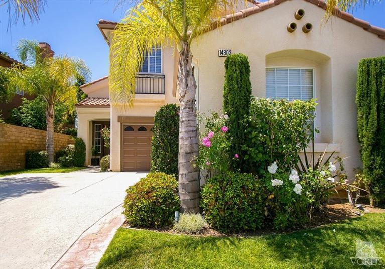 14303 Peach Hill Road Moorpark, CA 93021 - Photo 3 of 41 a front view of a house with garden