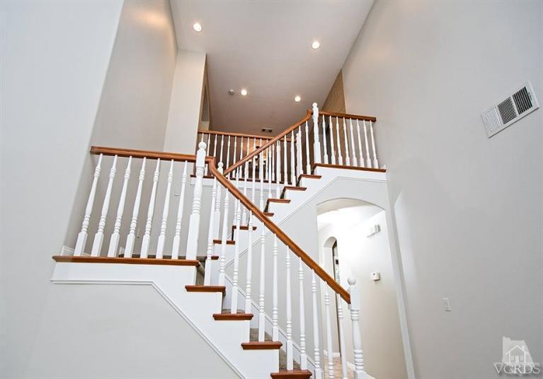 14303 Peach Hill Road Moorpark, CA 93021 - Photo 22 of 41 a view of staircase with railing and white walls