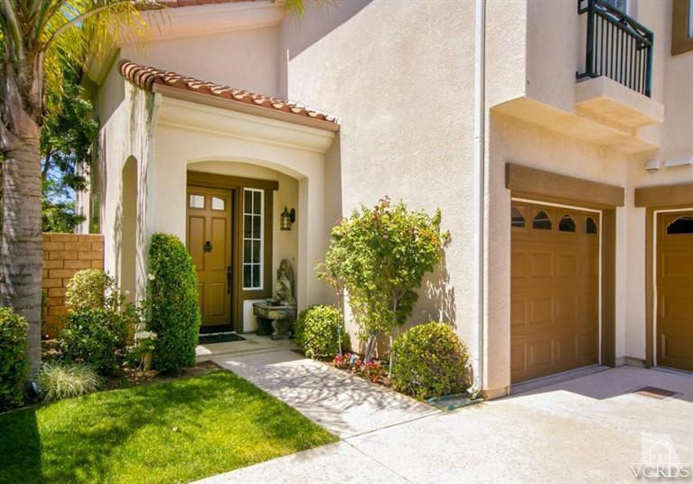 14303 Peach Hill Road Moorpark, CA 93021 - Photo 4 of 41 a front view of a house with garden