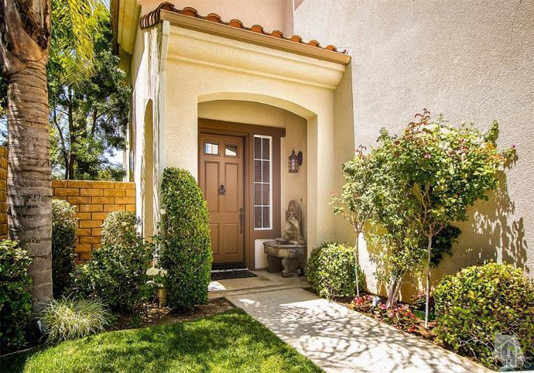 14303 Peach Hill Road Moorpark, CA 93021 - Photo 5 of 41 front view of a house with a garden
