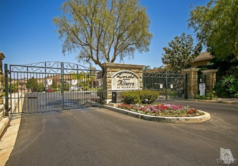 14303 Peach Hill Road Moorpark, CA 93021 - Photo 41 of 41 a sign board with parking space and a large tree