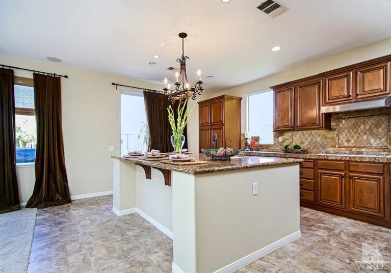 14303 Peach Hill Road Moorpark, CA 93021 - Photo 10 of 41 a kitchen with stainless steel appliances granite countertop a stove and a sink