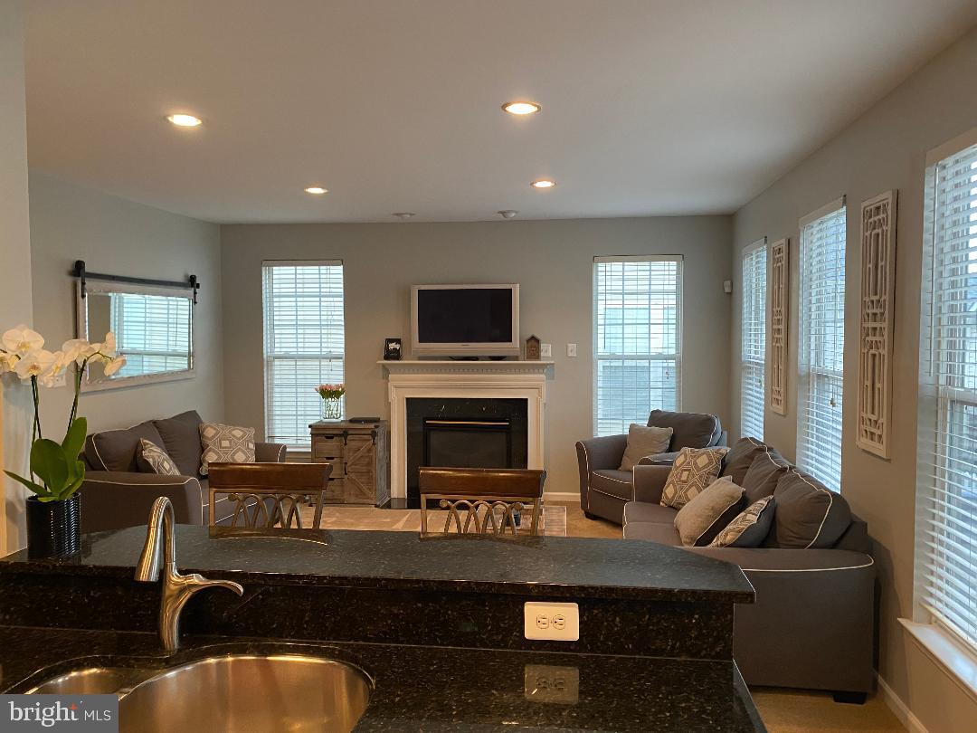 18421 Cornflower Road Boyds, MD 20841 - Photo 14 of 48 Another view of living room with gas fireplace.