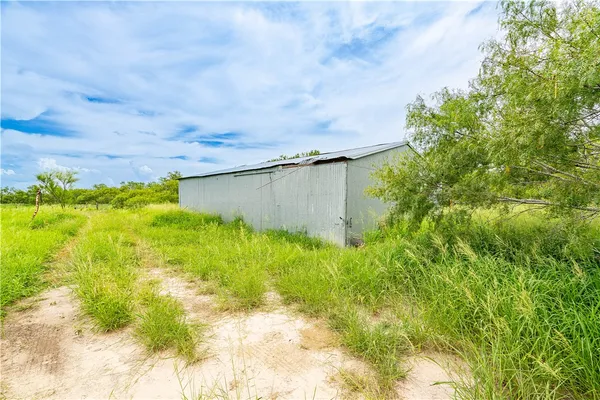 a backyard of a house with lots of green space