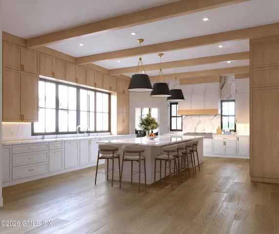 a kitchen with stainless steel appliances granite countertop a stove and cabinets