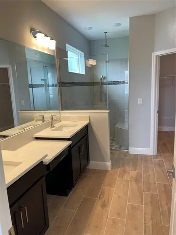 a bathroom with a sink vanity and a mirror
