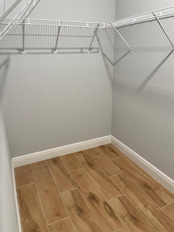 19284 Allium Place Orlando, FL 32827 - Photo 14 of 15 a view of a room with racks on the wall