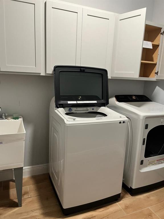 19284 Allium Place Orlando, FL 32827 - Photo 15 of 15 a utility room with dryer and washer