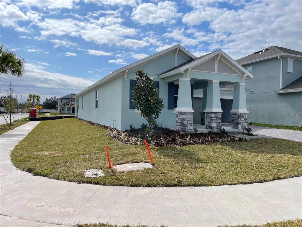 19284 Allium Place Orlando, FL 32827 - Photo 2 of 15 a view of a house with a yard