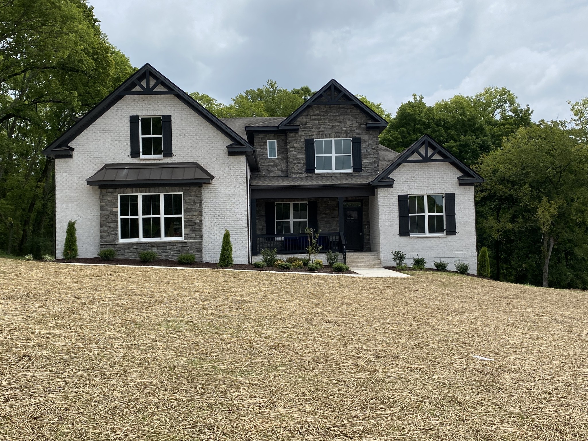 1074 Hideaway Road Columbia, TN 38401 - Photo 1 of 10 a front view of a house with a garden