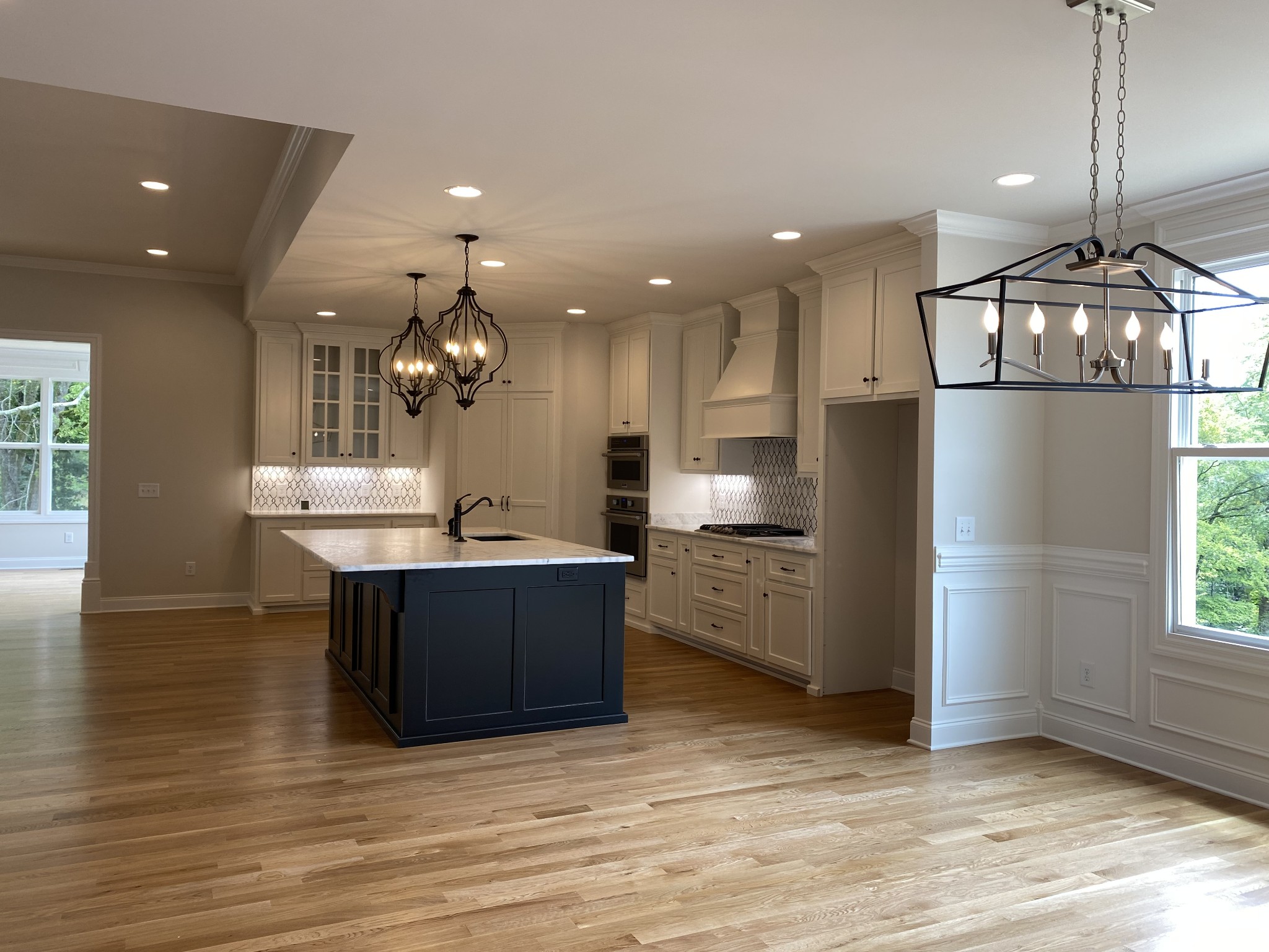 1074 Hideaway Road Columbia, TN 38401 - Photo 4 of 10 a view of kitchen with refrigerator microwave and wooden floor