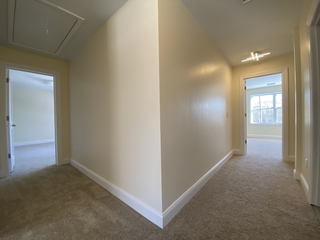 855 County Street, Unit 2 Attleboro, MA 02703 - Photo 17 of 27 a view of a hallway with closet