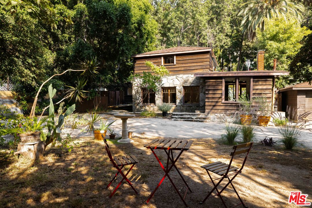 a view of house with yard