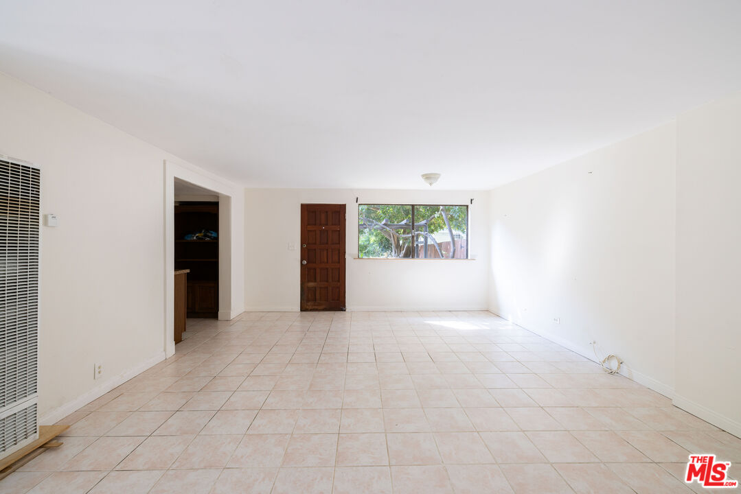 1748 Laurel Canyon Boulevard Los Angeles, CA 90046 - Photo 19 of 24 an empty room with windows