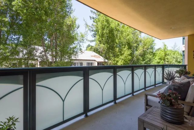 a view of balcony with furniture