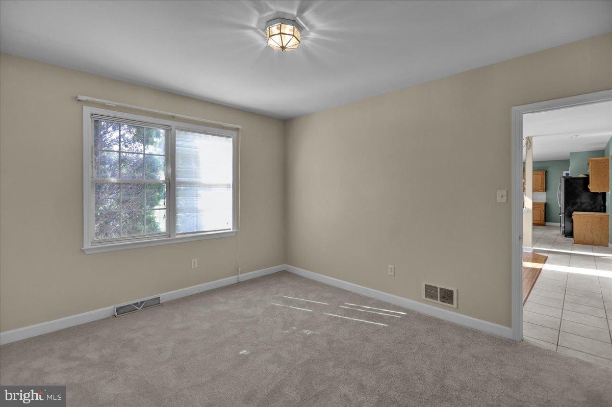 10 Virginia Avenue Sinking Spring, PA 19608 - Photo 4 of 35 an empty room with a empty space and a window