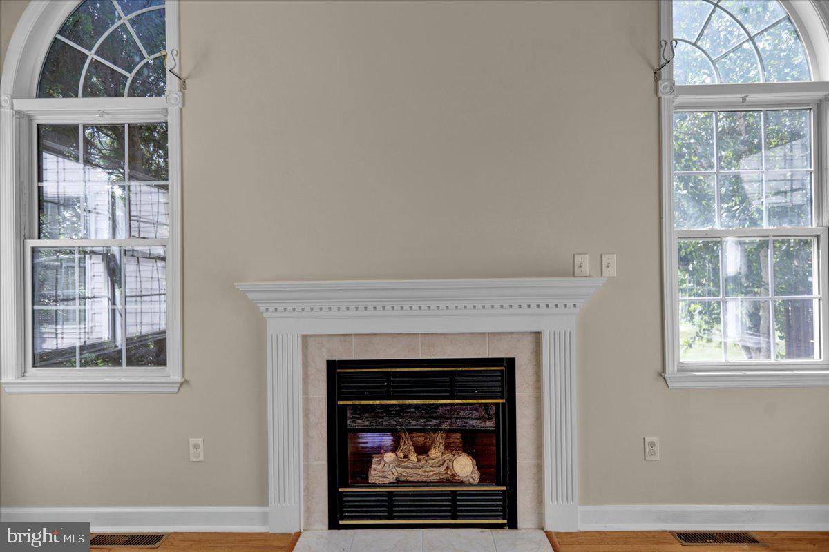 10 Virginia Avenue Sinking Spring, PA 19608 - Photo 10 of 35 a living room with a fireplace and a window