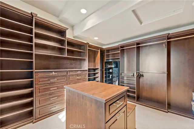 a kitchen with a refrigerator and a refrigerator