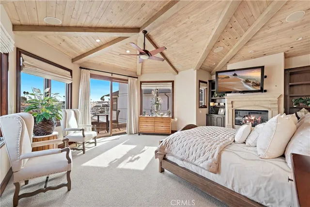 a bedroom with furniture and a fireplace