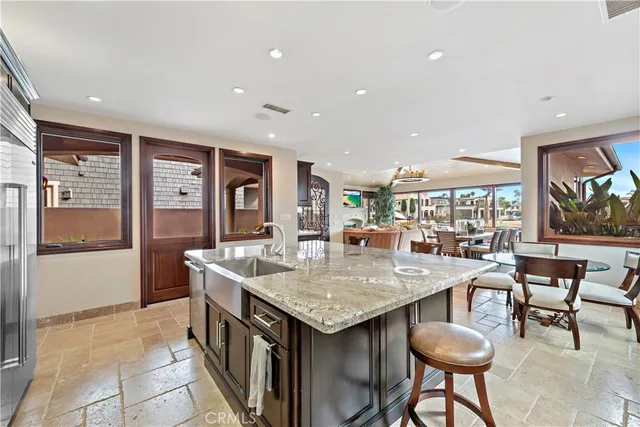 a kitchen with a table and chairs