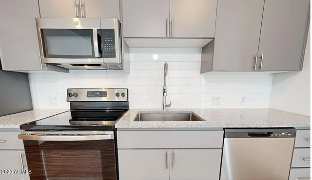 a kitchen with a stove and a microwave