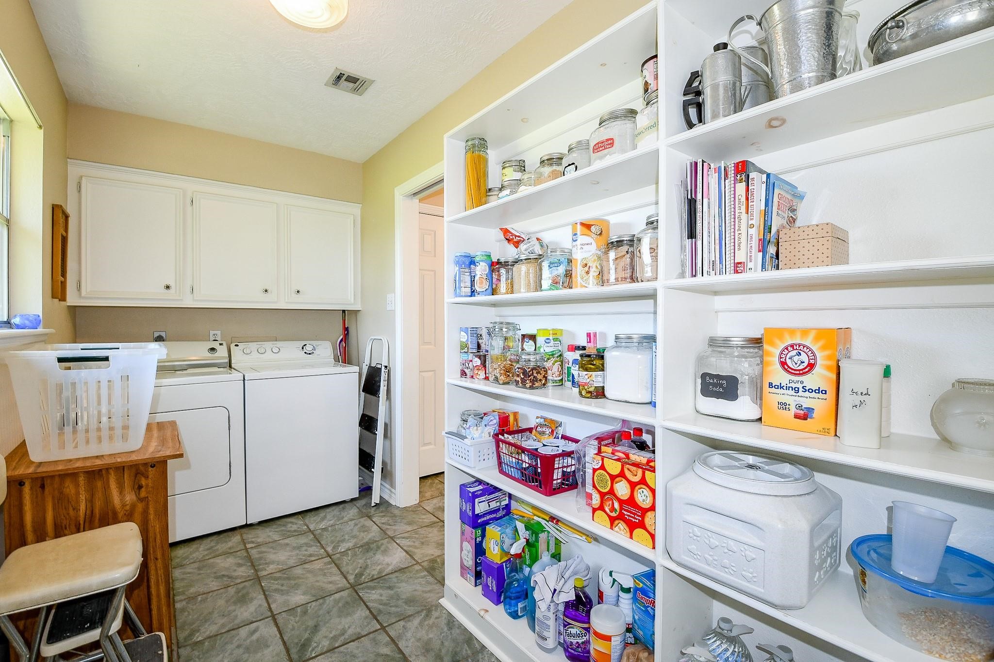 22035 Buescher Road Tomball, TX 77377 - Photo 40 of 43 a utility room with fridge dryer and washer