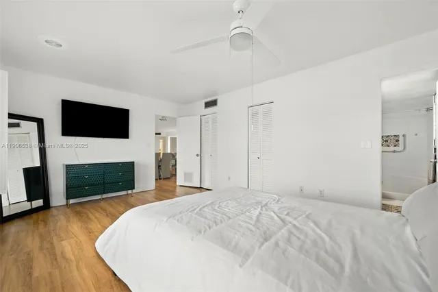 a bedroom with a bed and a fireplace