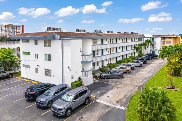a wooden bench sitting in front of a building