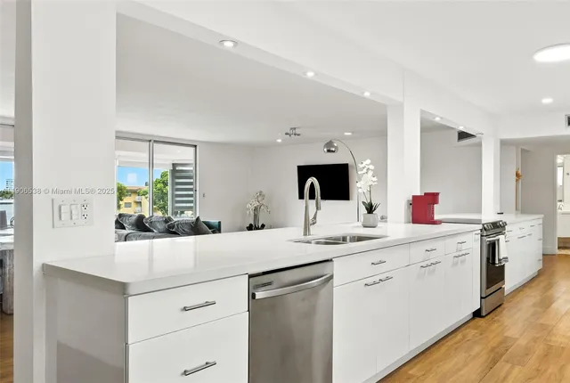 a kitchen with a sink and cabinets