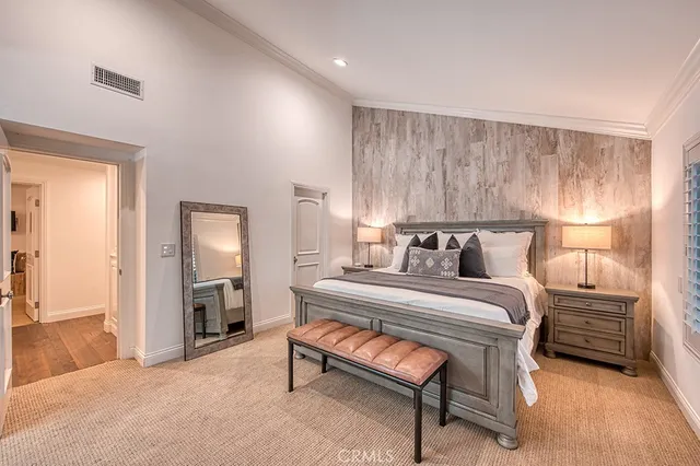 a bedroom with a bed and a couch