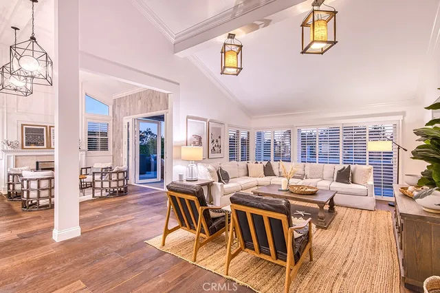 a view of a dining room with furniture wooden floor and chandelier