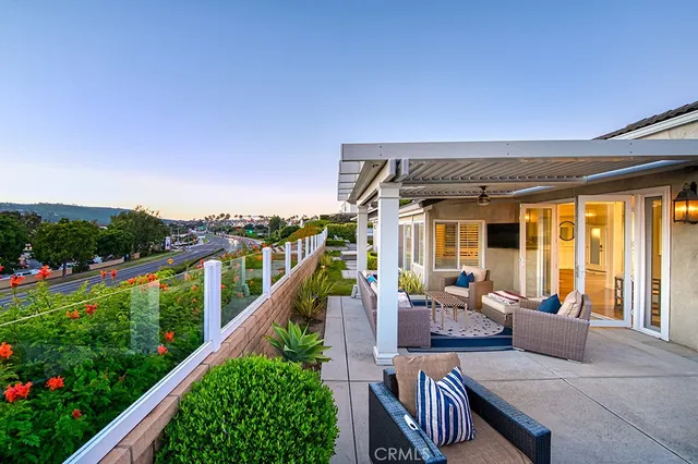 a balcony with furniture and garden view