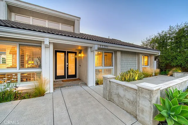 a view of house with backyard space and porch