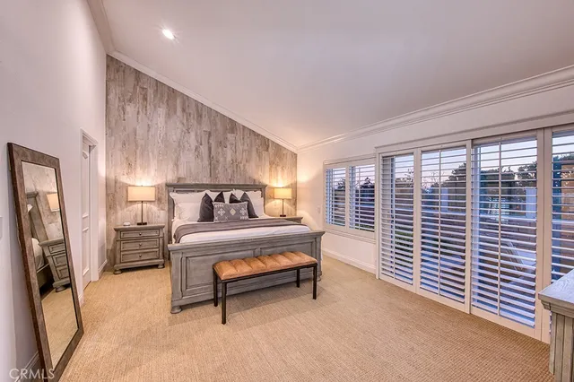 a bedroom with furniture and a window