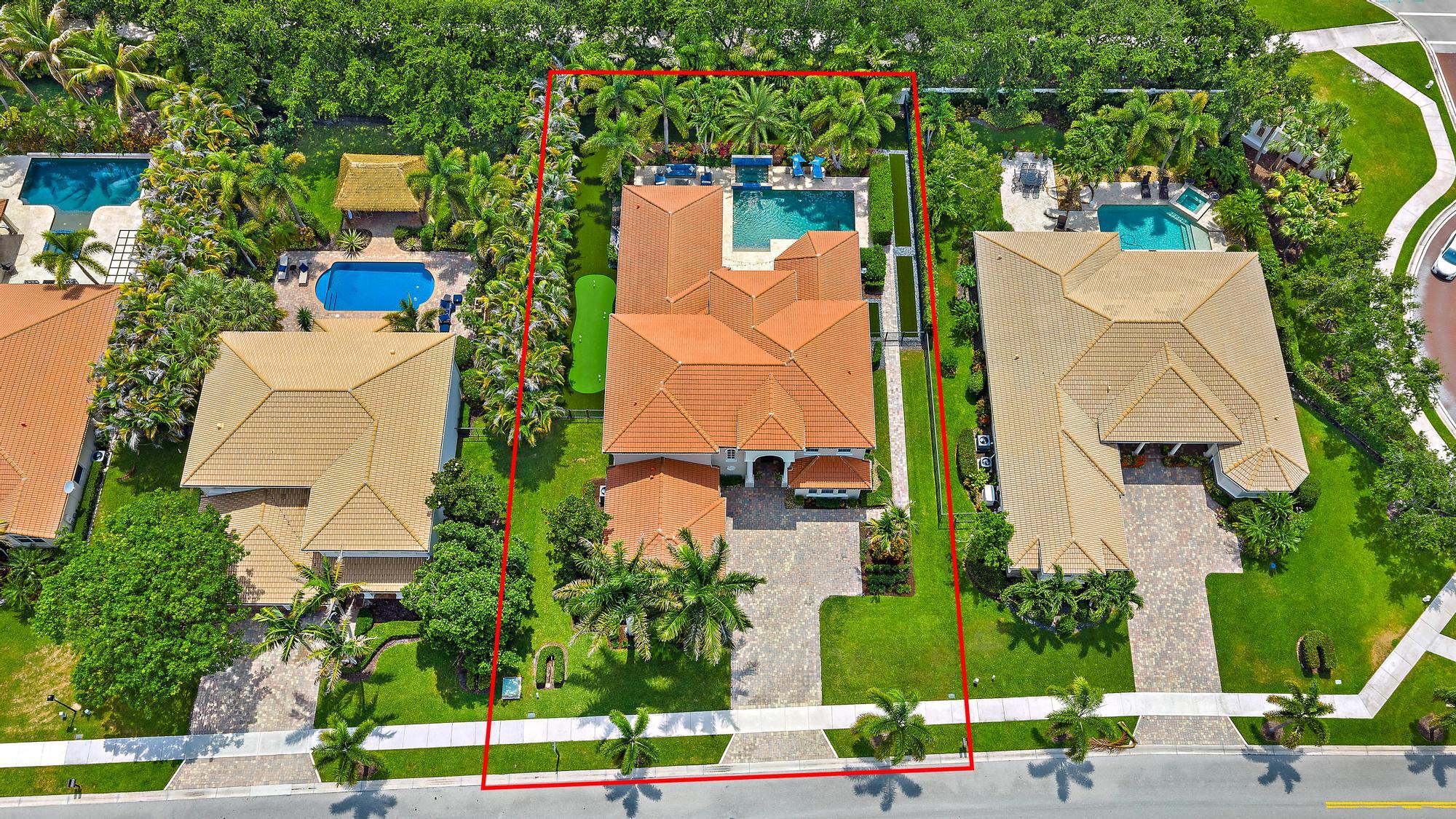 283 Rudder Cay Way Jupiter, FL 33458 - Photo 26 of 41 an aerial view of multiple houses with yard