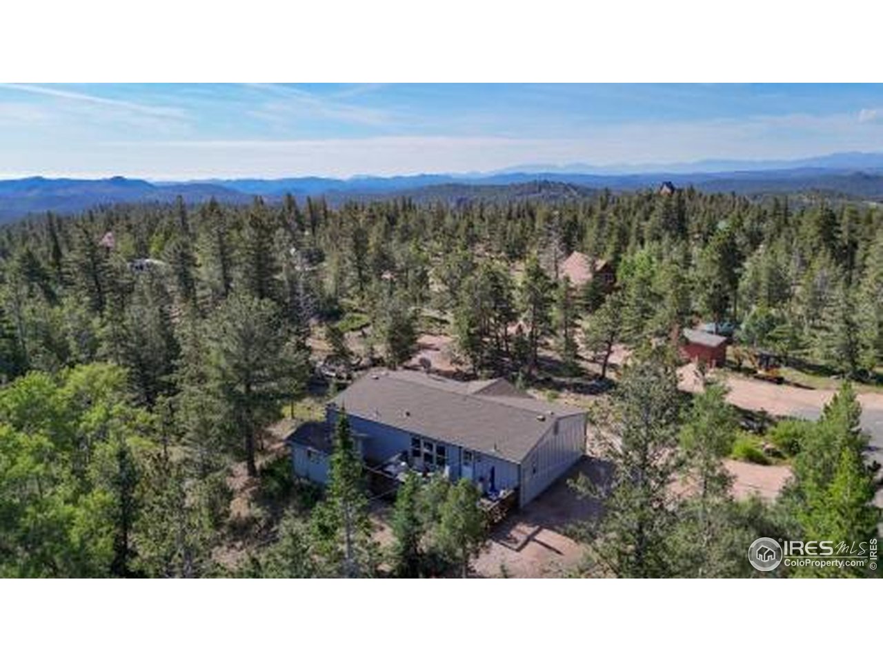 62 Spokane Court Red Feather Lakes, CO 80545 - Photo 3 of 38 a view of a city with sunset view