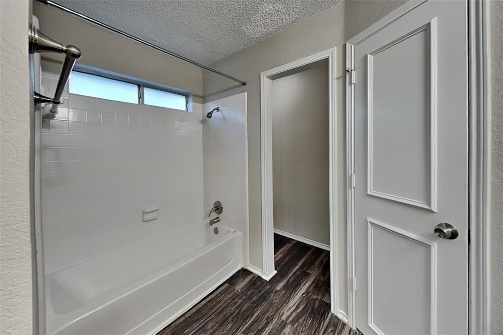 7836 Prairie Drive Watauga, TX 76148 - Photo 11 of 20 a bathroom with a bathtub and a shower