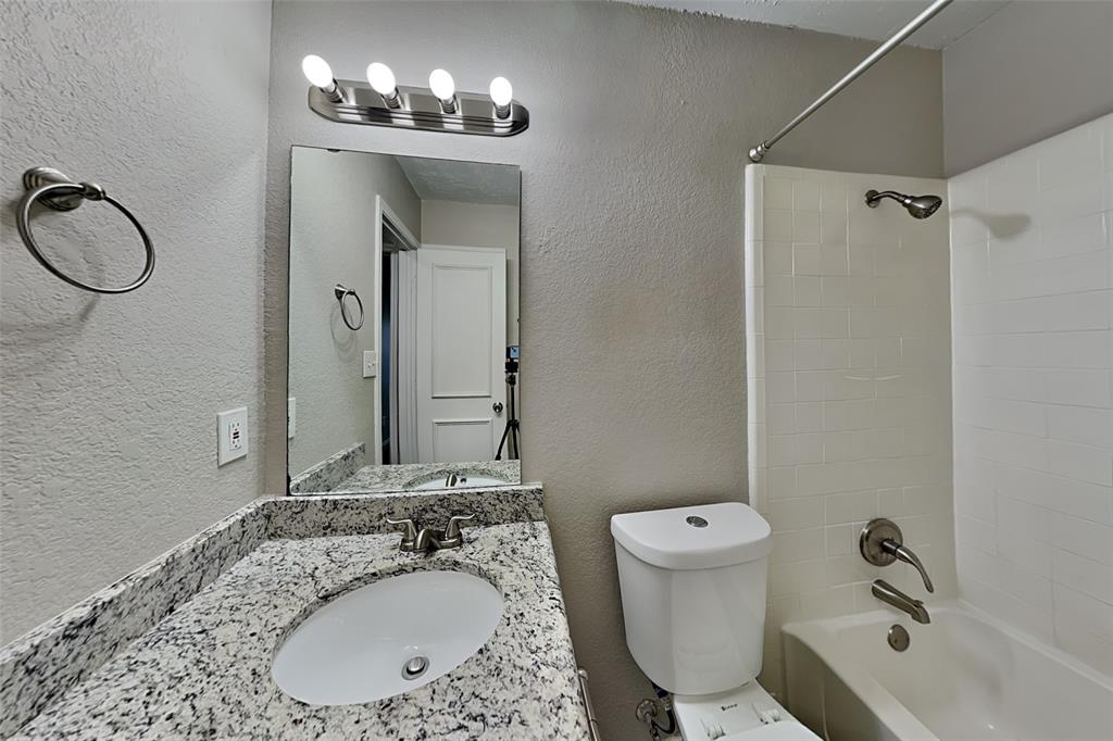 7836 Prairie Drive Watauga, TX 76148 - Photo 17 of 20 a bathroom with a sink and a mirror