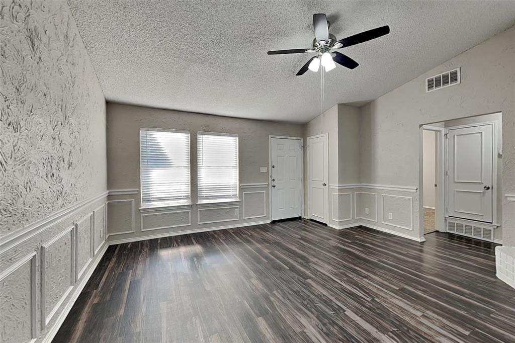 7836 Prairie Drive Watauga, TX 76148 - Photo 4 of 20 wooden floor in an empty room with a window