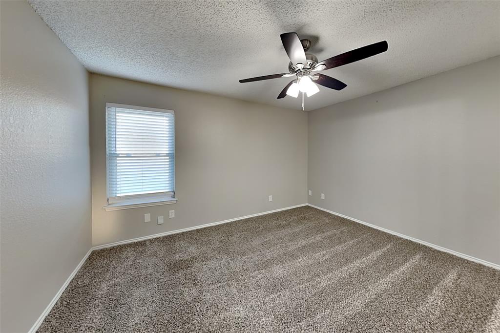7836 Prairie Drive Watauga, TX 76148 - Photo 9 of 20 an empty room with closet and windows