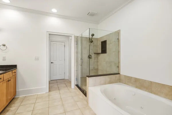 a bathroom with a bathtub and a shower