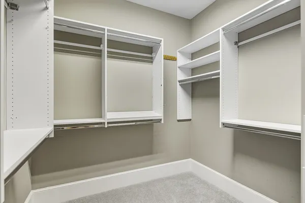 a view of an empty room with cabinet