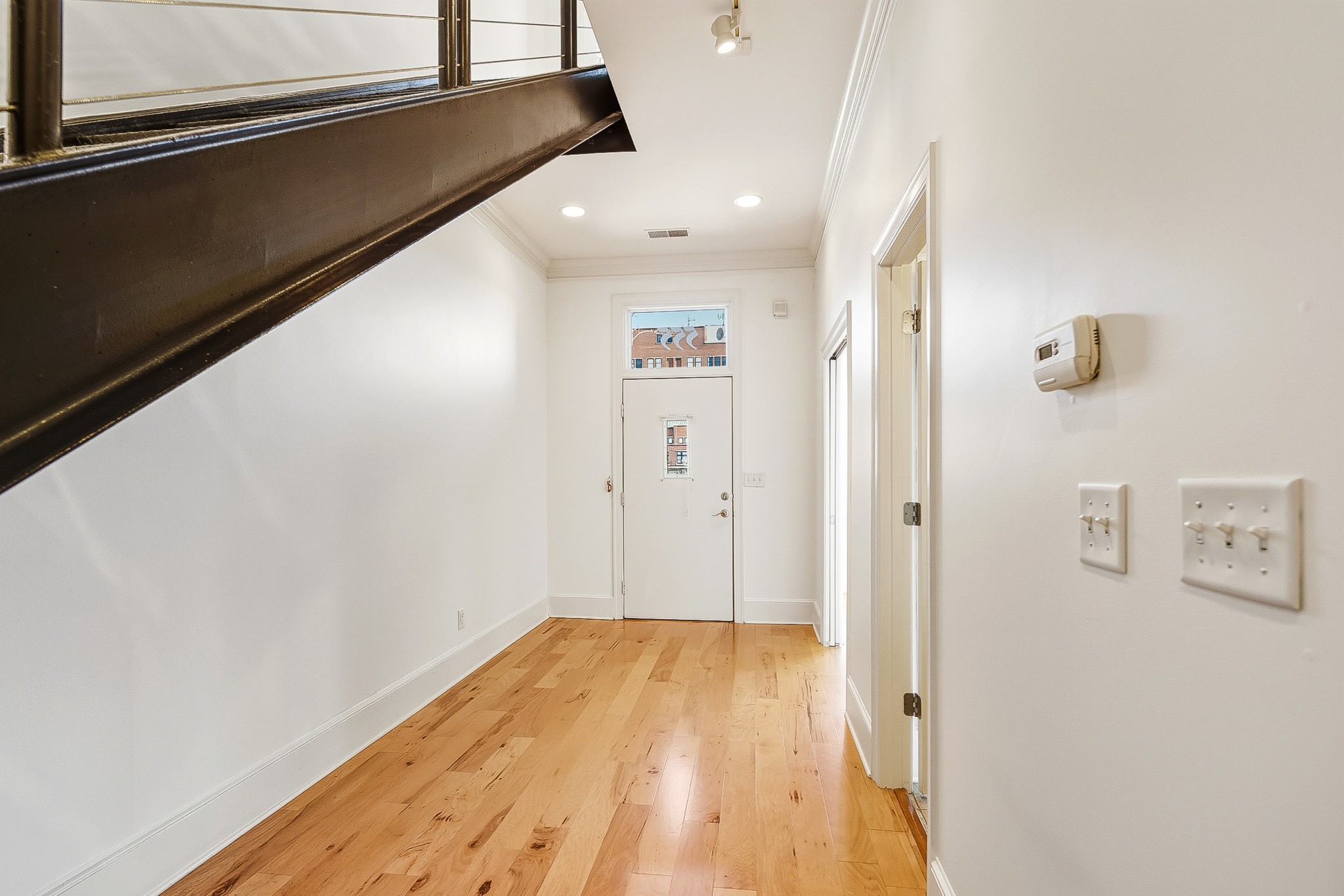 555 South Front Street Memphis, TN 38103 - Photo 3 of 31 a view of a hallway with wooden floor
