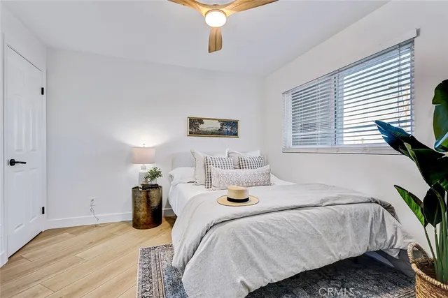 a bedroom with bed and a window