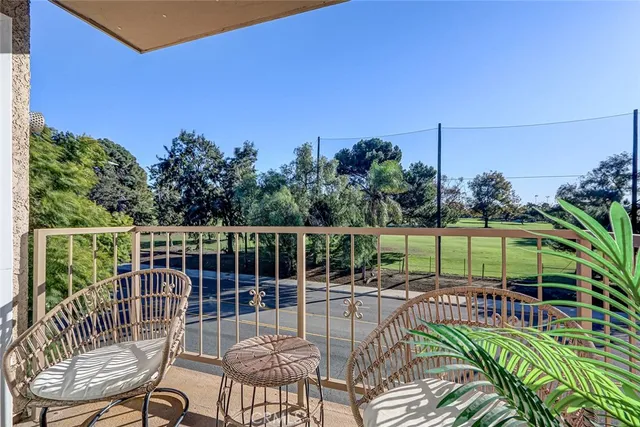 a view of a chair and tables the patio