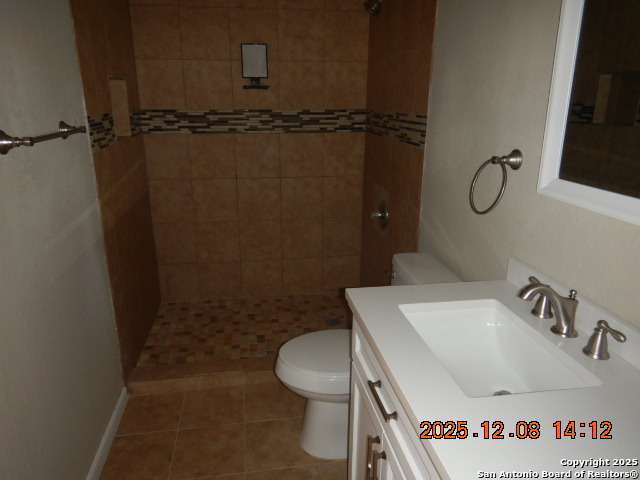8931 Dakota Run Converse, TX 78109 - Photo 10 of 13 a bathroom with a sink and a toilet