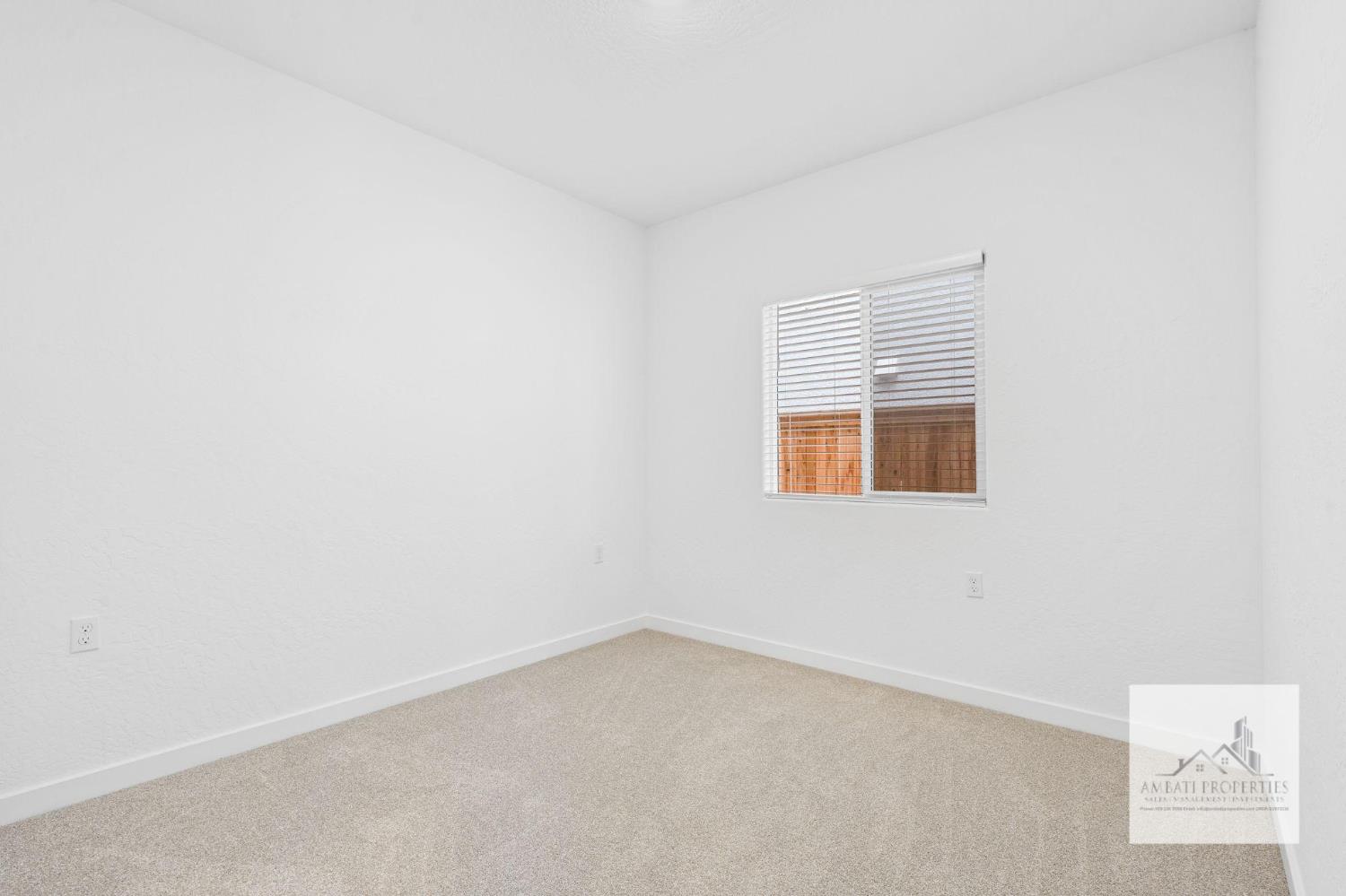1017 Springtime Avenue Clovis, CA 93619 - Photo 11 of 13 an empty room with a window