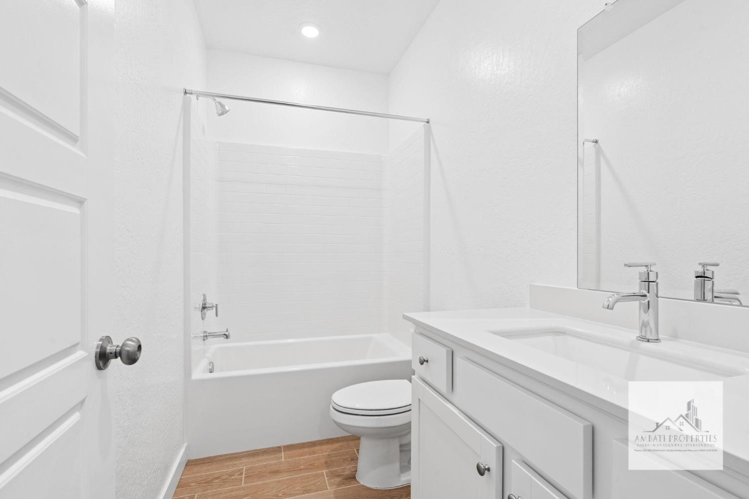 1017 Springtime Avenue Clovis, CA 93619 - Photo 4 of 13 a bathroom with a sink a toilet and shower